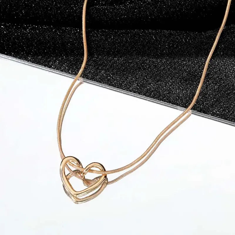 Twisted Heart Pendant Necklace – Gold Tone