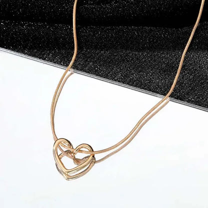 Twisted Heart Pendant Necklace – Gold Tone